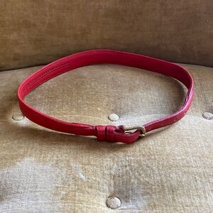 Coach red leather and brass buckle belt, 26” by 1” approximately, used